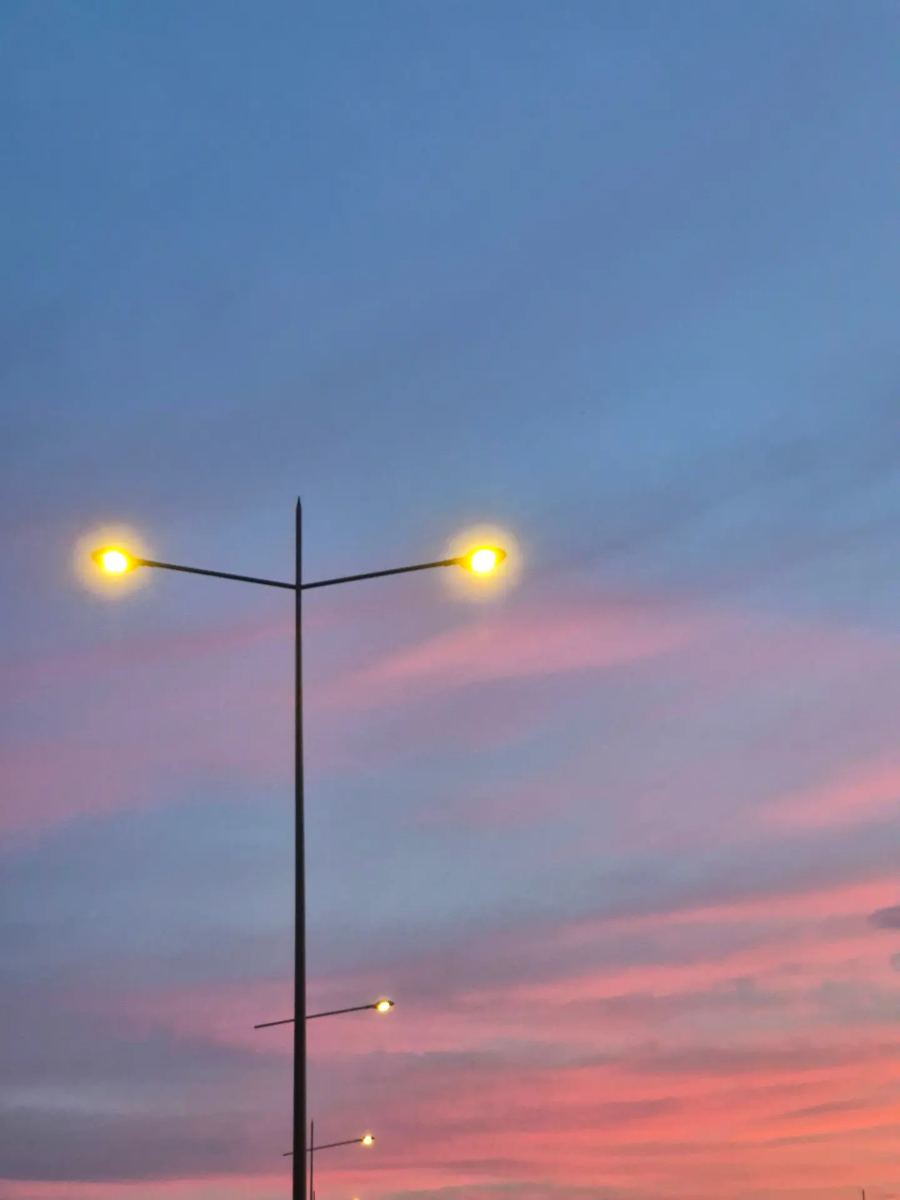 Street lamps against a twilight sky